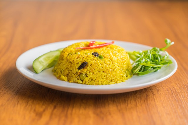 Ilustrasi Cara Membuat Nasi Kuning. Foto: Freepik