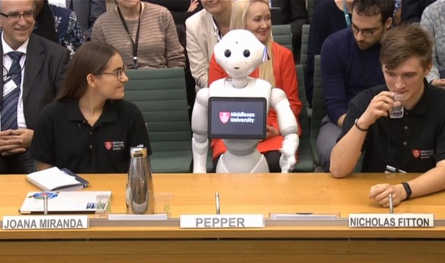 Robot bernama Pepper menghadiri sidang Komite Pendidikan di Parlemen London. PHOTO BY HO / VARIOUS SOURCES / AFP