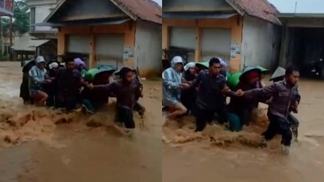 Viral Dua Polisi Hujan-hujanan Terjang Banjir Deras demi Selamatkan Ibu-Ibu (64626)