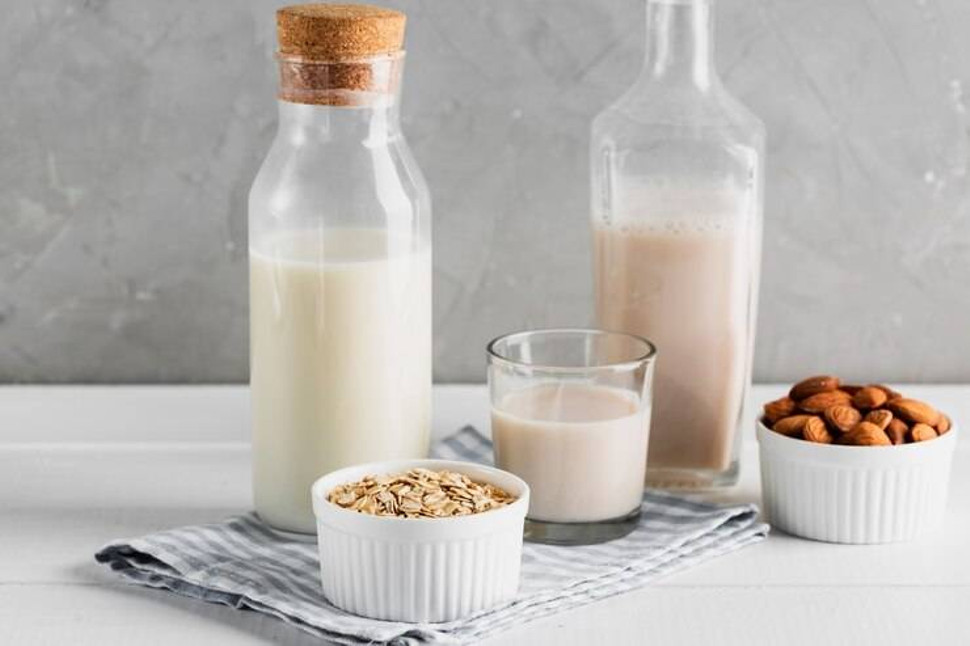 set-milk-bottles-glasses-with-oatmeal-almonds_23-2148356819.jpg